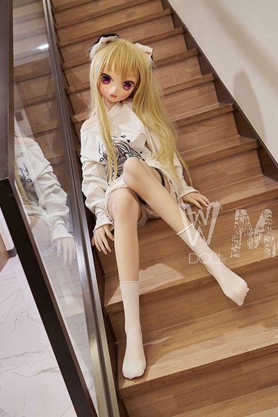 sitting doll on the stairs