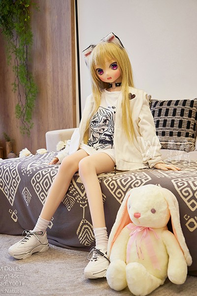 sitting doll on bed