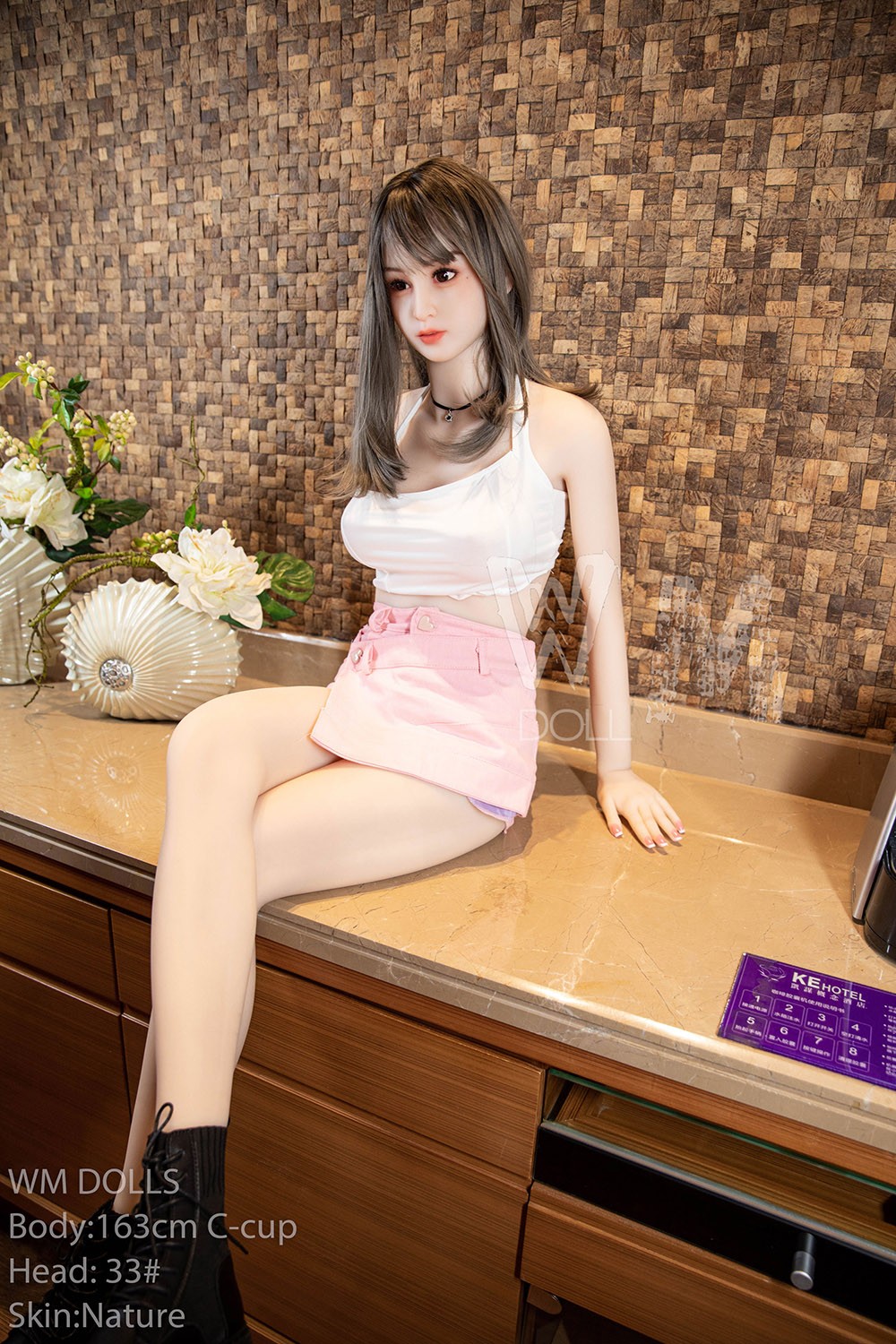 sitting pink skirt doll
