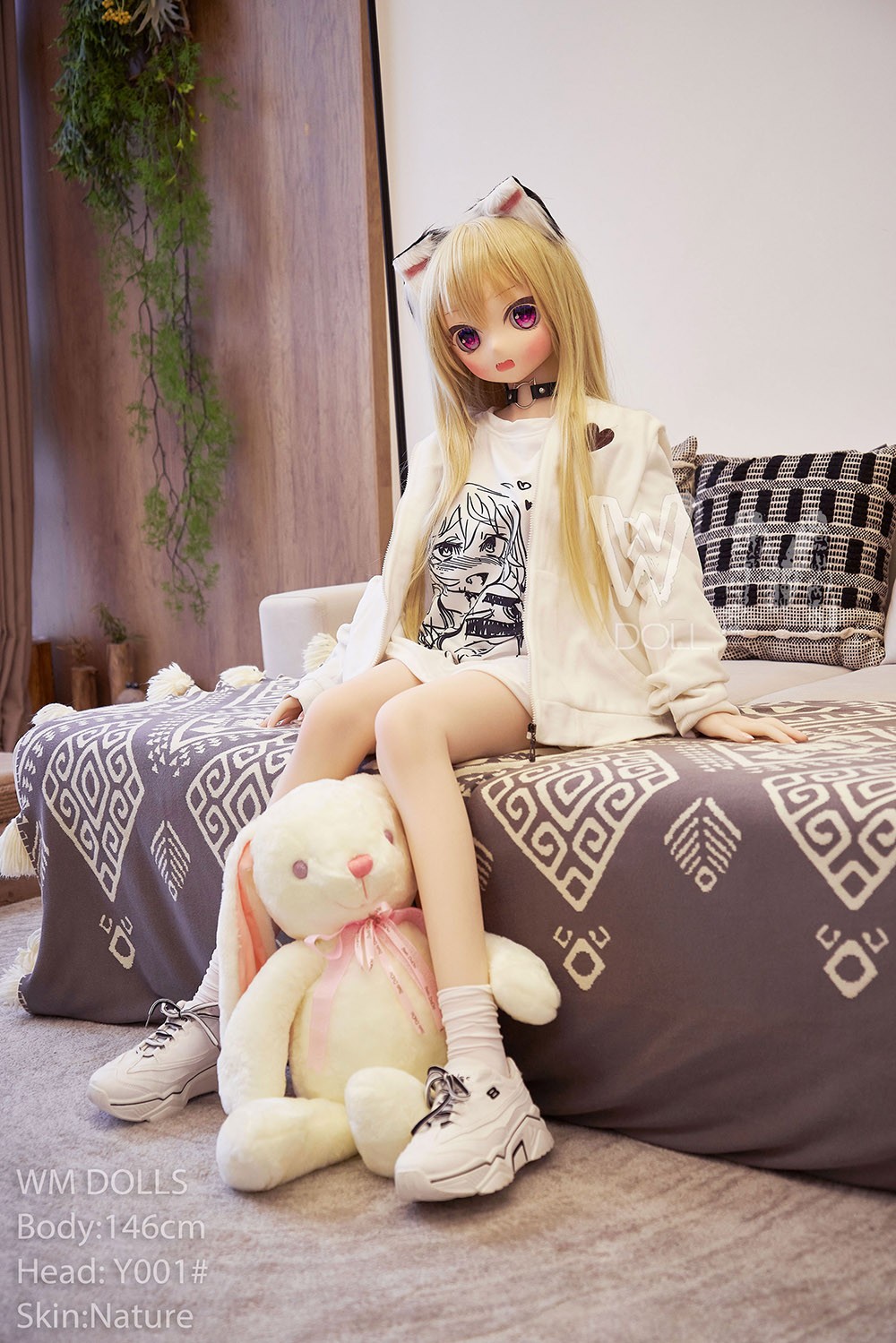 sitting anime doll on bed
